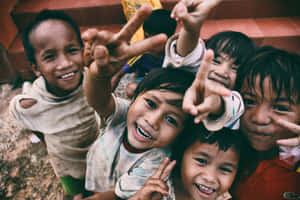 Happy Kids From A Poor Country Wallpaper