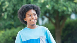 Happy Mixed Race Boy Outdoors.jpg Wallpaper