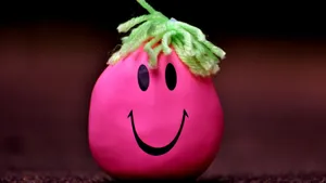 Happy Pink Smiley Ball With Green Hair Wallpaper
