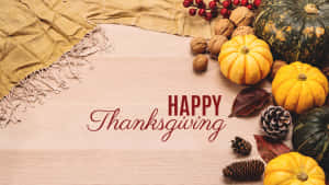 Happy Thanksgiving With Pumpkins And Pine Cones Wallpaper