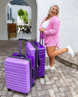 Happy Traveler With Purple Luggage Set Wallpaper