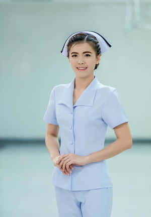 Happy Young Asian Nursing Woman Wallpaper
