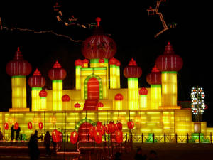 Harbin's Dazzling Ice Palace Aglow At Night Wallpaper