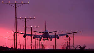 Hd Plane Landing Sunset Wallpaper