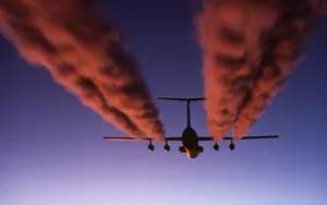 Hd Plane With Red Contrails Wallpaper