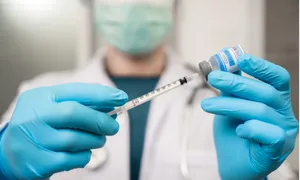 Healthcare Professional Preparing Vaccine Wallpaper