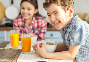 Healthy Children Enjoying Breakfast Wallpaper
