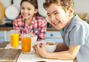 Healthy Children Enjoying Breakfast Wallpaper