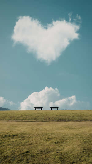 Heart Shaped Cloud Over Benches Wallpaper