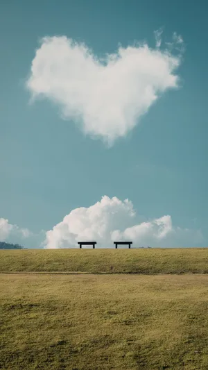 Heart Shaped Cloud Over Benches Wallpaper