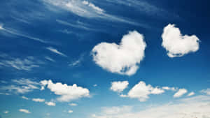 Heart Shaped Clouds In Blue Sky Wallpaper