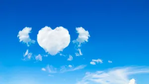 Heart Shaped Clouds In Blue Sky Wallpaper