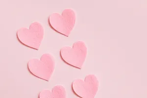 Heart Shaped Cutouts In Soft Ravishing Hues Wallpaper