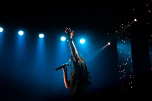 Heartfelt Worship - Christian Worship Leader Invoking Divine Love Wallpaper