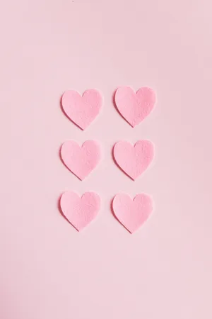 Hearts On Pink Background Wallpaper
