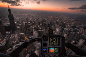 Helicopter Cockpit View Over Cityat Dusk Wallpaper