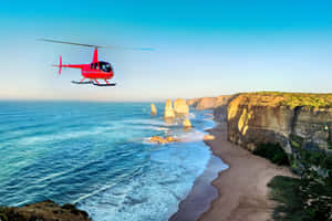 Helicopter In Twelve Apostles In Victoria Australia Wallpaper