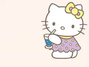 Hello Kitty Laptop Sipping Drink Wallpaper