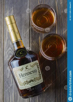 Hennessy Whiskey Bottle And Glasses On Wooden Background Wallpaper