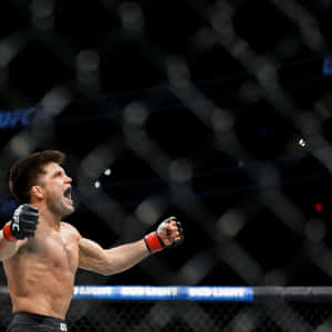 Henry Cejudo Celebrating Victory Over Tj Dillashaw Wallpaper