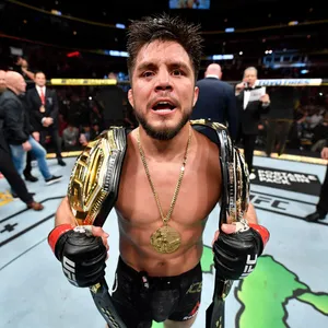 Henry Cejudo's Triumphant Victory Over Marlon Moraes At Ufc 238 Wallpaper