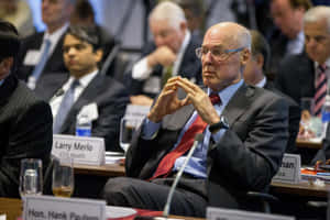 Henry Paulson Sitting In Conference Wallpaper