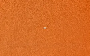 Hermes Logo On Textured Orange Background Wallpaper