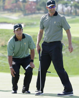 Hideki Matsuyama With Fellow Golfer Wallpaper