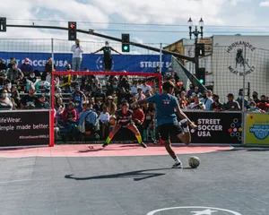 High-energy Street Soccer Match Wallpaper