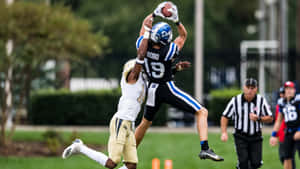 High Flying Catch Football Game Wallpaper