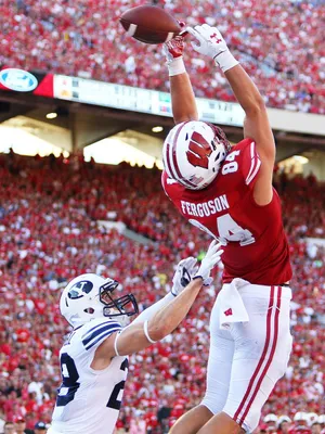 High Flying Football Catch Wallpaper