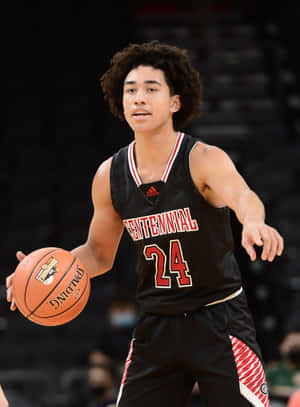 High School Basketball Player Dribbling Wallpaper