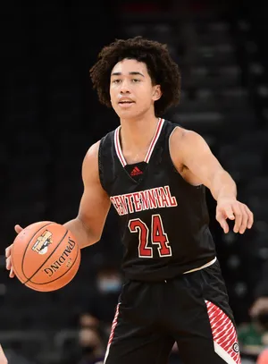 High School Basketball Player Dribbling Wallpaper