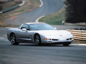 High-speed Red Chevrolet Corvette C5 On The Road Wallpaper