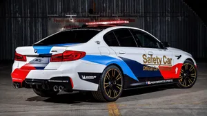 High-speed Safety Car On The Track Wallpaper