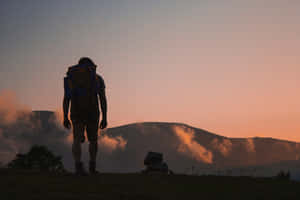 Hiker Silhouette Sunset Trek Wallpaper