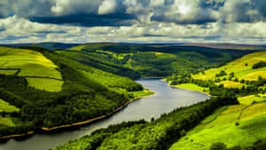 Hills Surrounding A River Wallpaper