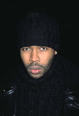 Hip Hop_ Artist_in_ Black_ Attire Wallpaper