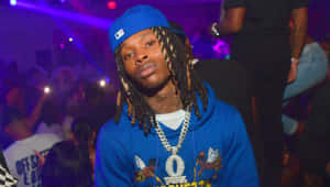 Hip Hop_ Artist_in_ Blue_ Hat_and_ Chains.jpg Wallpaper