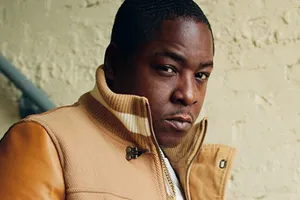 Hip Hop_ Artist_in_ Leather_ Jacket Wallpaper