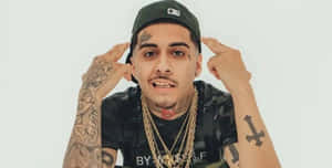 Hip Hop_ Artist_with_ Tattoos_and_ Gold_ Chains.jpg Wallpaper