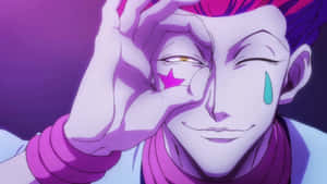 Hisoka Morow Smirking In A Close-up Portrait Wallpaper