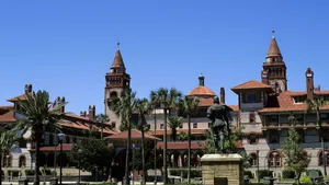 Historic_ College_ Building_with_ Statue Wallpaper