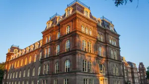 Historic College Buildingat Dusk Wallpaper