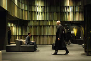 Hitman Agent 47 Walking In A Lobby Wallpaper