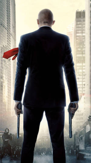 Hitman Holding His Weapon Wallpaper