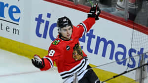 Hockey Player Celebrating On Ice Wallpaper