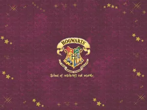 Hogwarts Crest - The Emblem Of Magic And Legacy Wallpaper