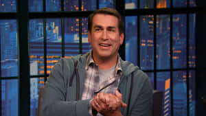 Hollywood Comedian Rob Riggle Glowing In Spotlight Wallpaper