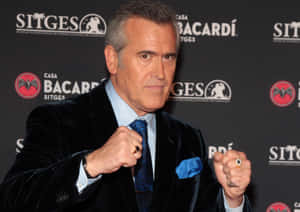 Hollywood Icon - Bruce Campbell In Action Wallpaper